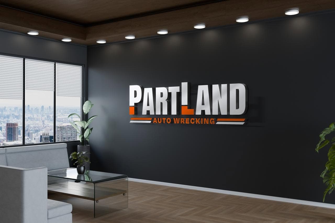 PartLand Auto Wrecking — PartLand branding on the office wall